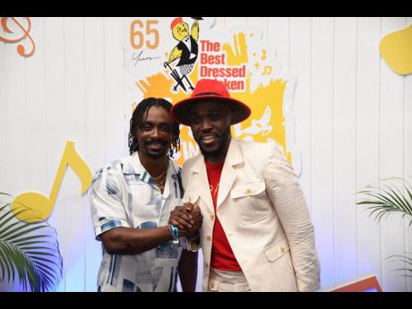Reggae-dancehall artiste Christopher Martin (left) and  gospel recording artist Kevin Downswell pose backstage at Saturday’s Fun in the Son. 