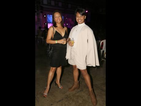 Argie Aicrag (left), accountant and pageant coach, wearing Incerun casual wear and Katherine Ann Paleracio, his engineering sister in a V-cut black dress for the Miss Universe Jamaica East coronation.