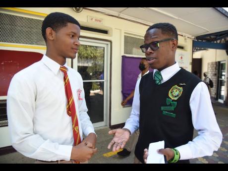 Nicholas Lumley (left), head boy of Mona High, and Zachary Walker, president of Calabar High’s Students’ Council, discussing ways to keep the communication going between both schools after an incident between students from both schools ignited a brawl 