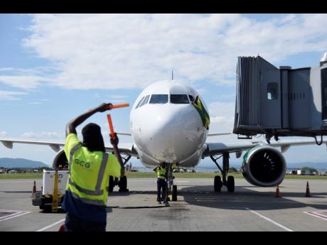 
A Frontier airplane displaying the Jamaican flag taxis on the runway at Norman Manley International Airport on November 7, 2022.