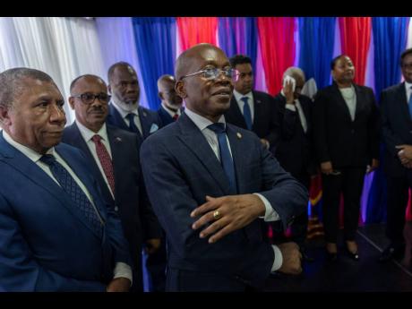 Michel Patrick Boisvert (centre), who was named interim prime minister by outgoing Prime Minister Ariel Henry, attends the swearing-in ceremony of the transitional council tasked with selecting Haiti’s new prime minister and cabinet, in Port-au-Prince, H