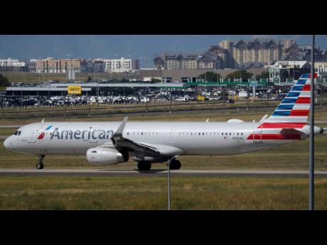 An American Airlines jetliner waits on a runway for departure from Denver International Airport Friday, September 1, 2023, in Denver, Colorado.