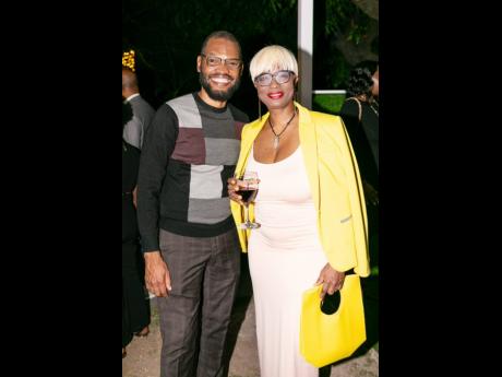 Raymond Pryce, media personality and environmentalist, pairs up with Ophelia McKnight, CEO and founder of The Destination Collective, who elegantly rocked a silk dress paired with a yellow blazer and matching purse.