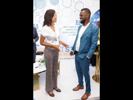 Dr Arlene Rose, founder and CEO of Jamaica Centre for Advanced Medicine/DermaKare, converses with Mohan Beckford of Next Step Digital Solutions during BizCon at The Jamaica Pegasus.