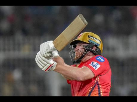 Jonny Bairstow plays a shot during his unbeaten century off 45 balls which spearheaded Punjab Kings to the highest successful run chase in Indian Premier League history against the Kolkata Knight Riders yesterday. 