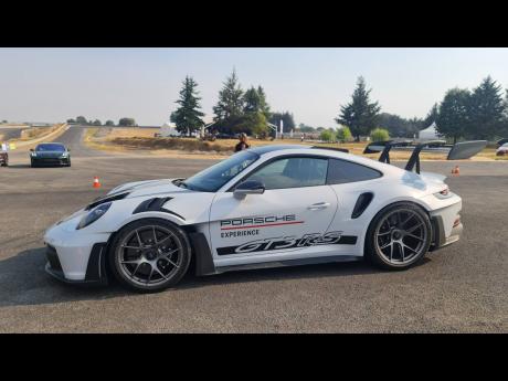 The awe-inspiring Porsche GT3 RS steals the show with its aerodynamic design and racing pedigree.