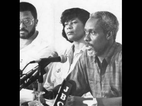 In this 1993 photo Prime Minister P.J. Patterson (right) is seen with then Minister of Labour Portia Simpson Miller. On the left is Peter Phillips. 