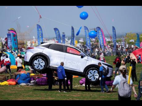 AP Photos
A car-shaped kite prepares to lift at the 41st International Kite Festival