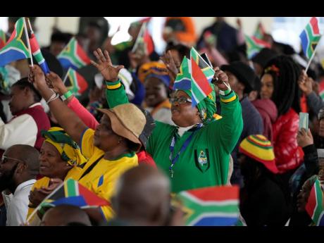 AP 
People attend Freedom Day celebrations in Pretoria, South Africa, on Saturday. The day marked April 27 when the country held a pivotal first democratic election in 1994 that announced the official end of the racial segregation and oppression of aparthe