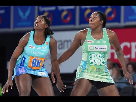 
Sunshine Girl and West Coast Fever goalshooter Jhaniele Fowler-Nembhard (right) looks to receive a pass during her Suncorp Super Netball League game against the Melbourne Mavericks yesterday.