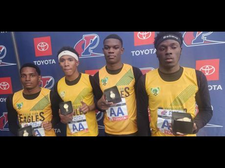 
From left: Excelsior High School’s Ryeem Walker, Damor Miller, Malike Nugent, and Lennon Green pose with their Championships of America 4x100 metres medals at the Penn Relays in Philadelphia, Pennsylvania, yesterday.