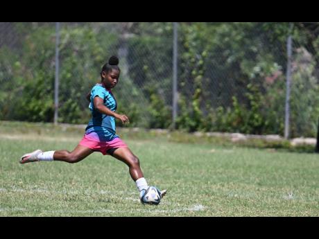 
Akelia Johnson of Frazsiers Whip FC in action in a Jamaica Women’s Premier League match against Cavalier at the Alpha Institute recently.