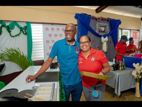 Mixology instructor at the HEART/NSTA Trust, Peta-Gaye Tain (right), and D&G Foundation Accountant Dennis Beckford (left), eagerly anticipate their turn to sample the creations of the trainees.