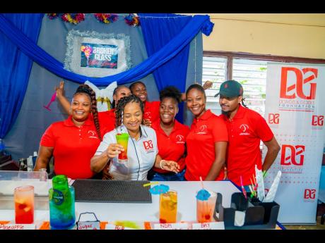 The D&G Foundation Administrator Totlyn Brown Robb excitedly participates in the ‘Bartenders’ Mix Off’, invited by the Broken Glass Ultra Lounge Group to sample their expertly mixed drinks.