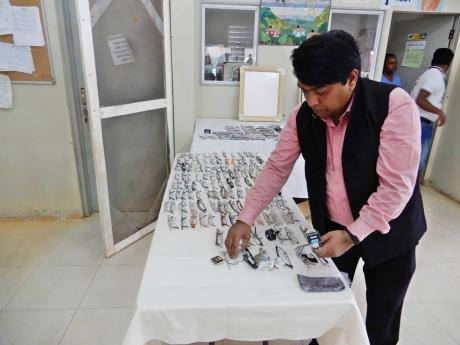 A volunteer placing glasses on a table at Jacob’s Ladder during the Indian High Commission’s health camp at the facility.