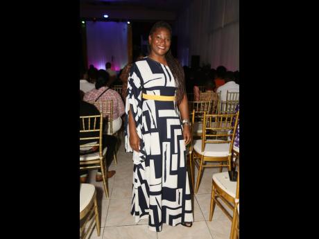 Diana Samuel, owner of D and L Apparel in Kingston, is dressed for the occasion in a geometric-print maxi to support her niece, contestant Micheala Cowan.