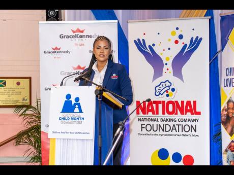 Lauri-Ann Samuels, executive director, National Baking Company Foundation, addresses the launch of Child Month on Thursday inside the Lecture Hall of the Institute of Jamaica in downtown Kingston. 