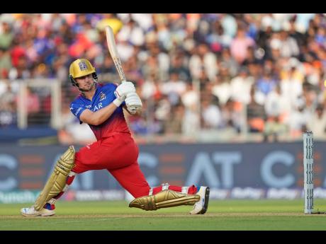 Royal Challengers Bengaluru’s Will Jacks on the go during the Indian Premier League cricket match between Gujarat Titans and Royal Challengers Bengaluru in Ahmedabad, India yesterday.