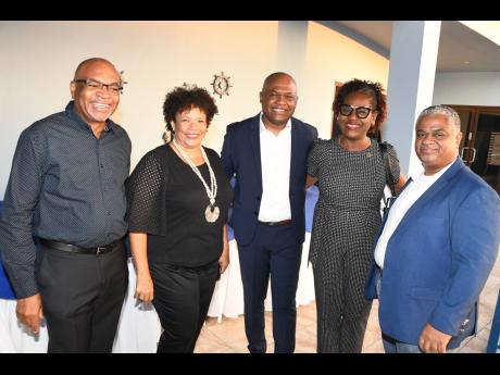  It was all smiles at the Shipping Association of Jamaica’s (SAJ) Members’ Mingle last Friday, April 26. From left: Trevor Riley, SAJ CEO; Corah Ann Robertson-Sylvester, SAJ president; Clive Coke, immediate past president of the Customs Brokers & Freig