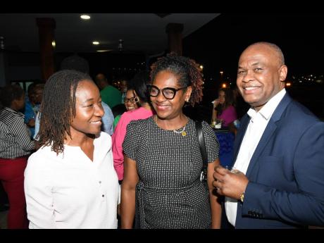 It was all smiles at the Shipping Association of Jamaica’s (SAJ) Members’ Mingle last Friday April 26. From left: Valrie Campbell, general manager of group operations, Kingston Wharves Limited; Marcia Bent, president of the Customs Brokers and Freight 