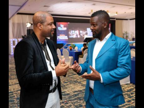 David Mullings (left), chief executive officer and chairman of Blue Mahoe Capital, during the inaugural BizCon: Innovation and Financing Conference for MSME’s held recently at the Jamaica Pegasus, with chief vision officer, Next Step Digital Solutions, M
