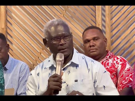 In this image taken from video, outgoing Solomon Islands Prime Minister Manasseh Sogavare speaks during a news conference on Monday, April 29, in Honiara, Solomon Islands. Sogavare on Monday withdrew from the contest to remain head of the strategically imp