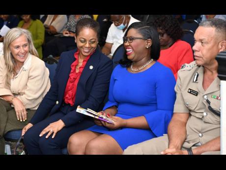 Minister of Legal and Constitutional Affairs Marlene Malahoo Forte (second left) shares a laugh with Ambassador Marianne Van Steen (left), head of the European Union Delegation to Jamaica; and Mickel Jackson, executive director, Jamaicans for Justice; as D