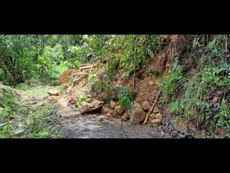 A look at a major landslide at Claverty Cottage, in West Portland, which is deemed impassable.