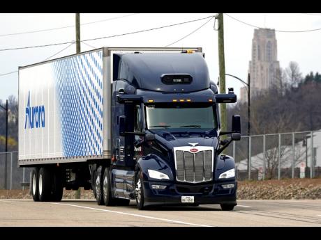 A self-driving tractor-trailer manoeuvres around a test track in Pittsburgh on Thursday, March 14, 2024. 