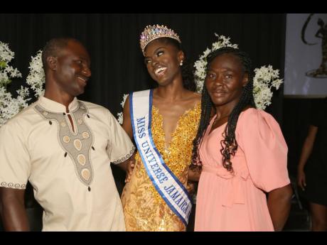 Fitzroy Downer was beaming as his daughter Deidrian Downer (centre) was crowned Miss Universe Jamaica Central. Sharing in the moment is her mother, Millicent Young-Downer. 