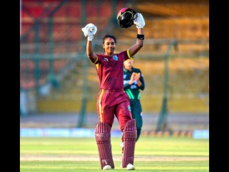 West Indies captain and opener Hayley Matthews raises her arms in celebration of scoring her second century of an ODI series against Pakistan at the National Bank Stadium in Pakistan on APril 23.