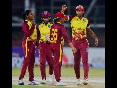 West Indies women celebrate a Pakistani wicket during the third T20 International of a series between the teams at the National Stadium in Pakistan yesterday.