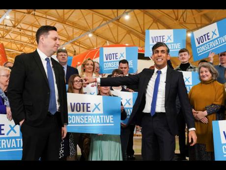 Conservative party candidate Lord Ben Houchen (left), with Britain’s Prime Minister Rishi Sunak following his re-election as Tees Valley Mayor in Teesside, England, on Friday May 3.