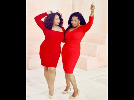 Plus-size model, Tricia Campbell (left), poses with media proprietor, Oprah Winfrey. 