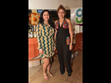 Susana Lira Audelo (right), representative of culture and cooperation at the Mexican Embassy, strikes a pose with Lisa Thompson, assistant to the Mexican ambassador.