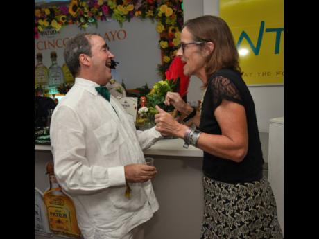 Mexican Ambassador Juan González Mijares and British High Commissioner to Jamaica Judith Slater engage in lively conversation..