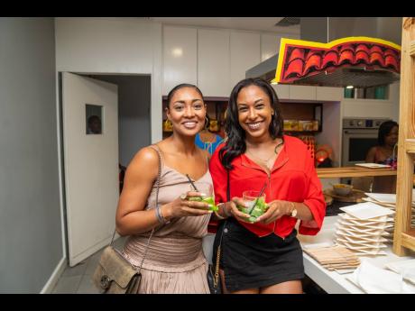 The Stacys stopped for tequila time while moving through the different food sections at La Fiesta. Our lens captured Stacy Ramcharan (left) and Stacy Grant with their tasty cocktails in hand.  