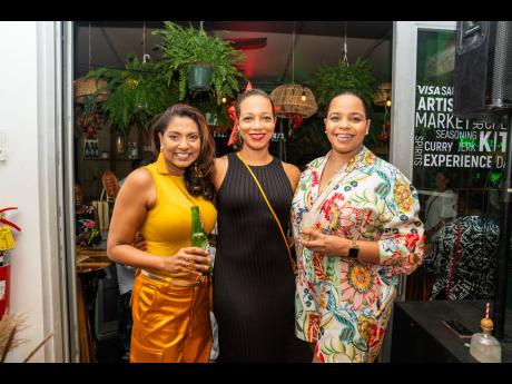 From left: Nadine Pandohie, managing director of Jamaica Food and Drink Kitchen; Kathryn Patterson, partner at Livingston Alexander & Levy, and Heineken Brand Manager Amoye Phillpotts-Brown pose for a photo op at La Fiesta on Friday.