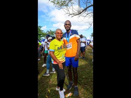 Dollis Campbell (left) of Dynamic Events joins Dr Andre Haughton, opposition spokesman on commerce, technology, and innovation, for a quick photo op.