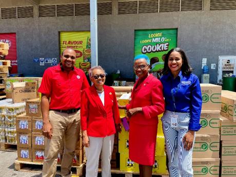 From left: Deputy Director Kevin Douglas, President Allasandra Chung and Director General Yvonne Clarke of the Jamaica Red Cross with Nestlé’s Public Relations Manager Camille Campbell during the disbursement ceremony which took place at Nestle’s Dist