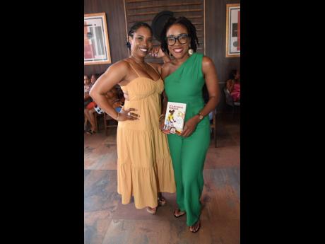 In this number from Treats The Finished Look, Sabrina Webster (left), poses with featured author Shelly-Ann Weeks.