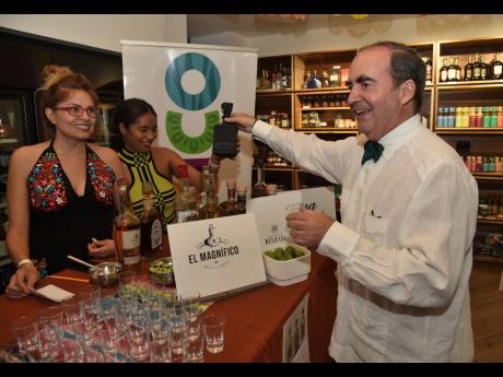 Mexican Ambassador to Jamaica Juan González Mijares starting the night with a shot of Cava de Oro Extra Anejo Black Tequila. 