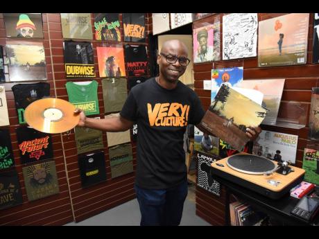 Rohan Scott, general manager, Street Supply Co, holds the vinyl record for Protoje’s ‘In Search of Lost Time’ in hand. 
