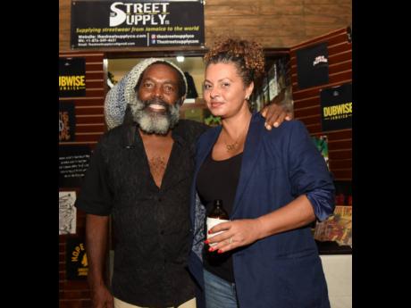 Eight Mile Sound’s Ronald ‘Uncle Ronnie’ Jarrett poses for pictures with Aicha Sangalli.