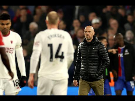 Manchester United’s head coach Erik ten Hag (right) walks on the pitch at the end of the English Premier League match between Crystal Palace and Manchester United at Selhurst Park stadium in London, England, Monday, May 6, 2024. 