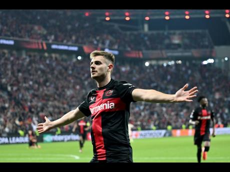Leverkusen’s Josip Stanisic celebrates after scoring a goal during the Europa League second leg semi-final match between Leverkusen and Roma at the BayArena in Leverkusen, Germany, yesterday.