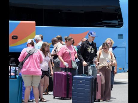 Tourists at the departures area at the Sangster International Airport in Montego Bay.