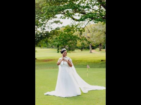 The bride, Candace Martin is regal in her custom Simply Majestic Designs gown.