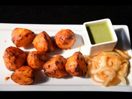The tandoori aloo is a traditional staple enjoyed with this tasty green chutney sauce.