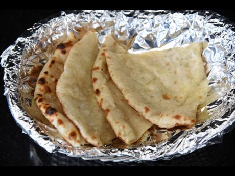Cheese naan, served hot and ready. 